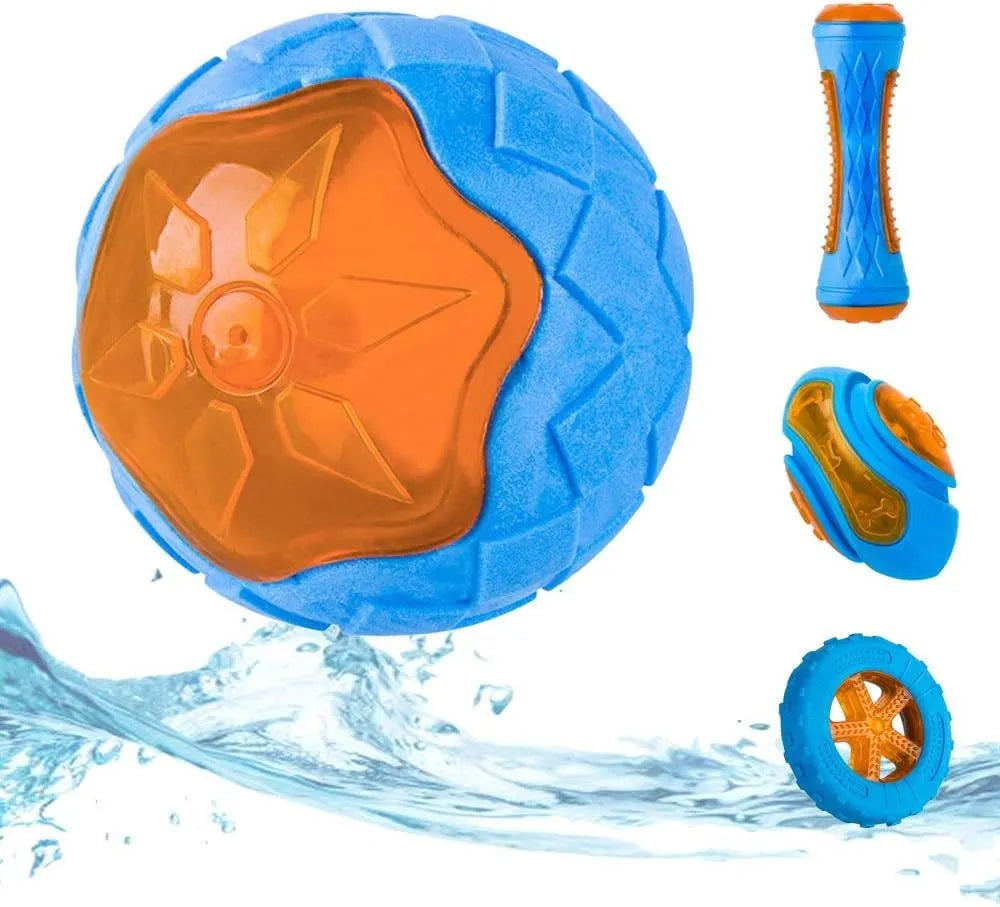 Set of three TPR dog toys: a yellow ball, a red barbell, and an orange tire with bumpy textures.