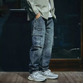 Men's blue loose straight leg retro style casual trousers on a neutral background