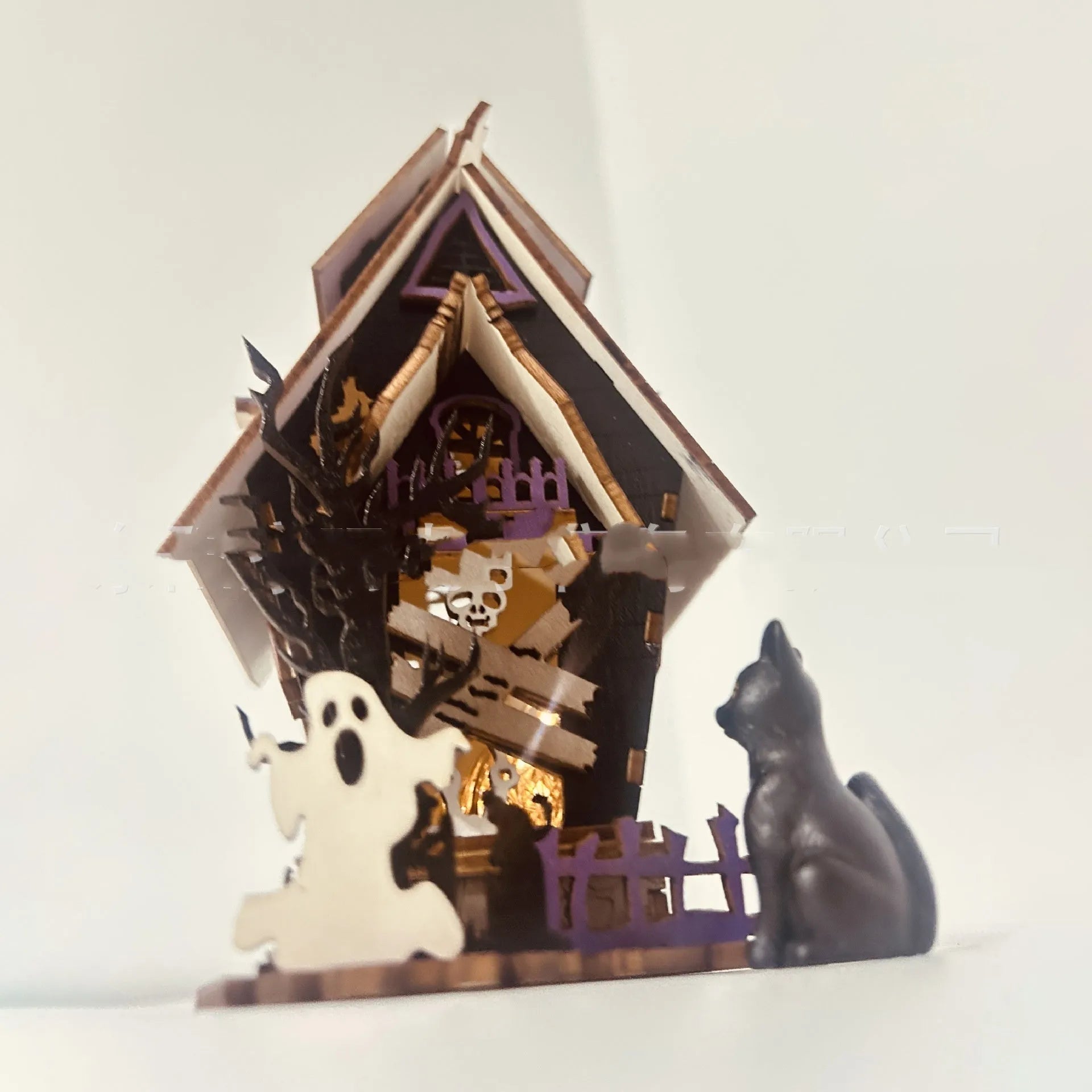 Wooden Halloween haunted house decoration with luminous finish on tabletop