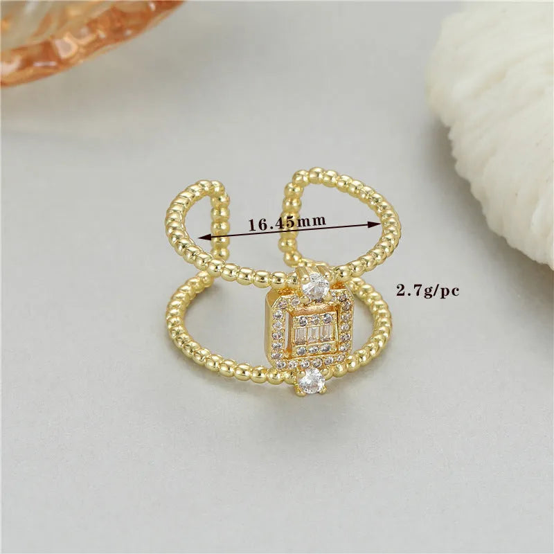 Copper adjustable open ring with asymmetric U-shape and gold colour finish