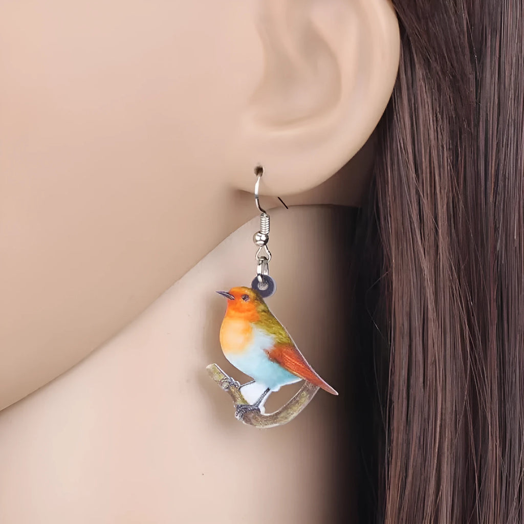 Acrylic Blue Titmouse pendant earrings with geometric bird design and snake elements