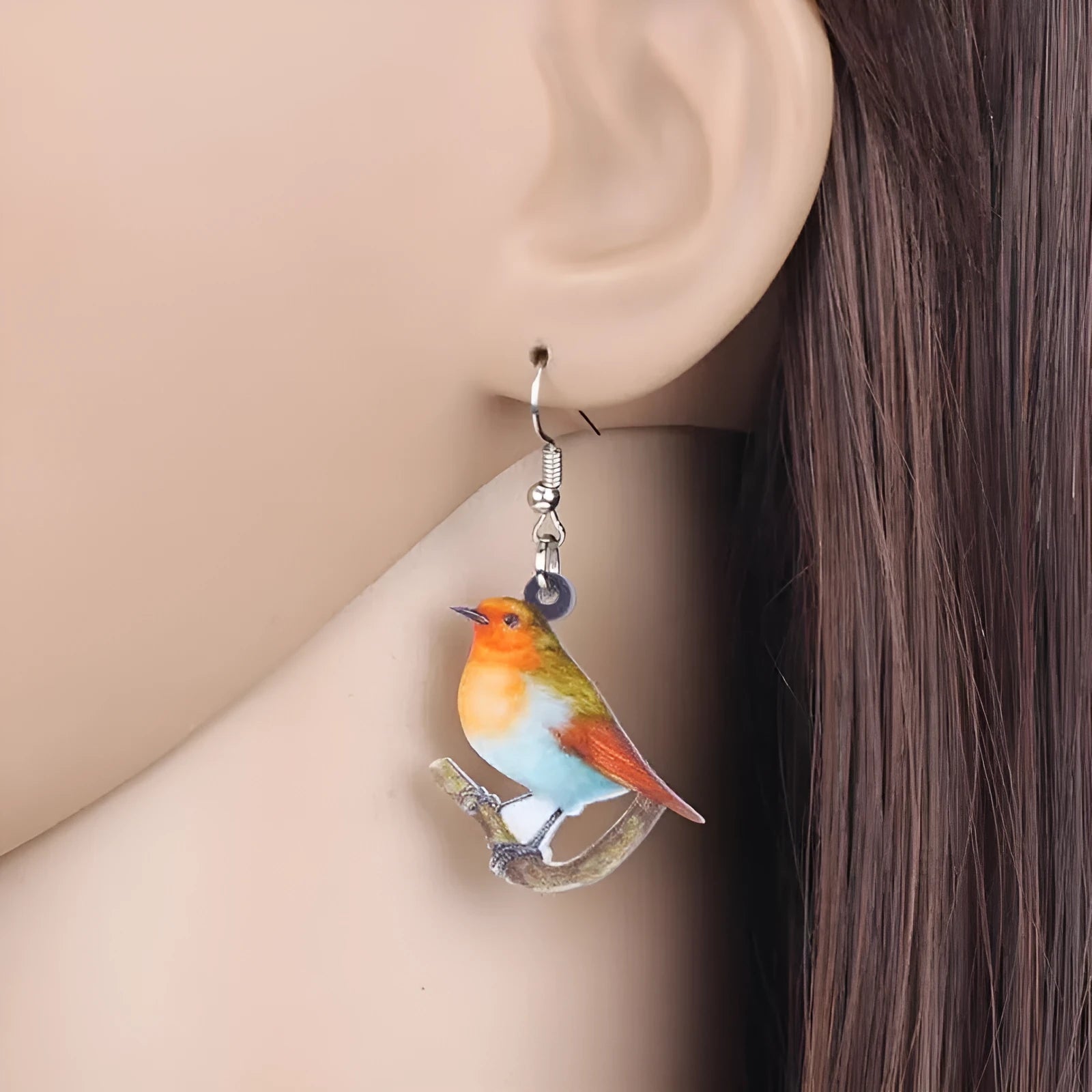 Acrylic Blue Titmouse pendant earrings with geometric bird design and snake elements