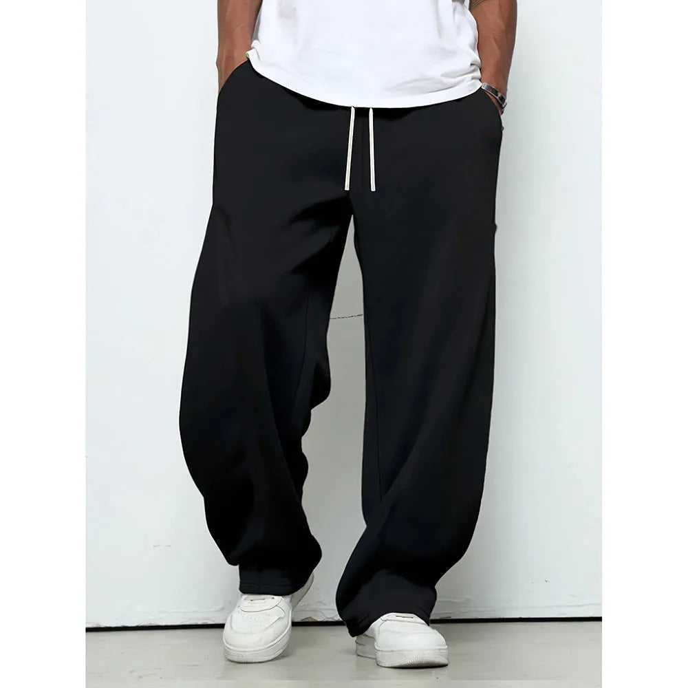 Men's straight-leg casual polyester trousers in black, shown with a drawstring waist.