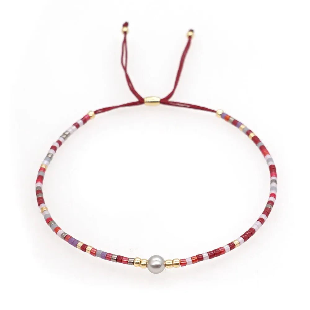 Colourful adjustable beaded bracelet with semi-precious stones and glass beads in bohemian style