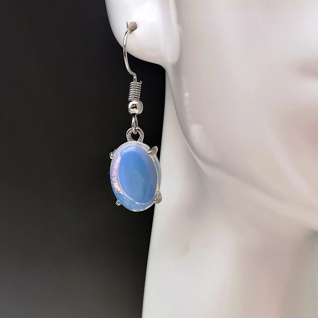 Women's opal earrings with drop shape design in moonlight white colour featuring cross element