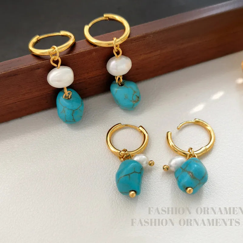 A pair of short and a pair of long turquoise cultured pearl ear clips with geometric copper settings.
