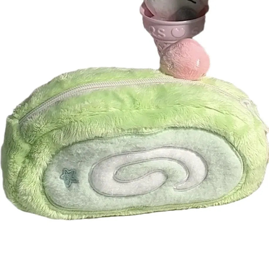 Honeydew coloured velvet pencil case with a Swiss roll cake design print.