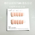 Set of frosted velvet Cat's Eye artificial nails in short ladder style on a clear background.