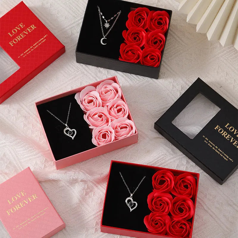 Korean-style gift box open to show six red rose-shaped soap flowers with gift handbag.