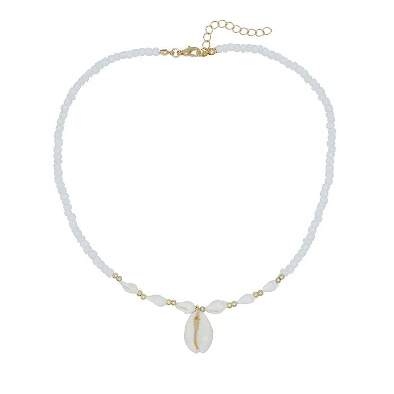 White shell bead necklace with conch pendant and mother-of-pearl detail