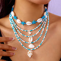Women's multi-layer necklace set with starfish and shell pendants in blue and assorted colours