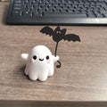 Miniature ghost walking dog Halloween statue made of resin, measuring 4x5x4cm.