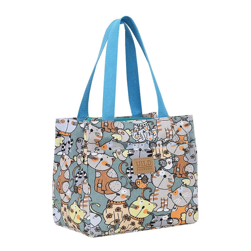 Women's printed canvas square handbag in a floral design, showing large capacity and structured shape.