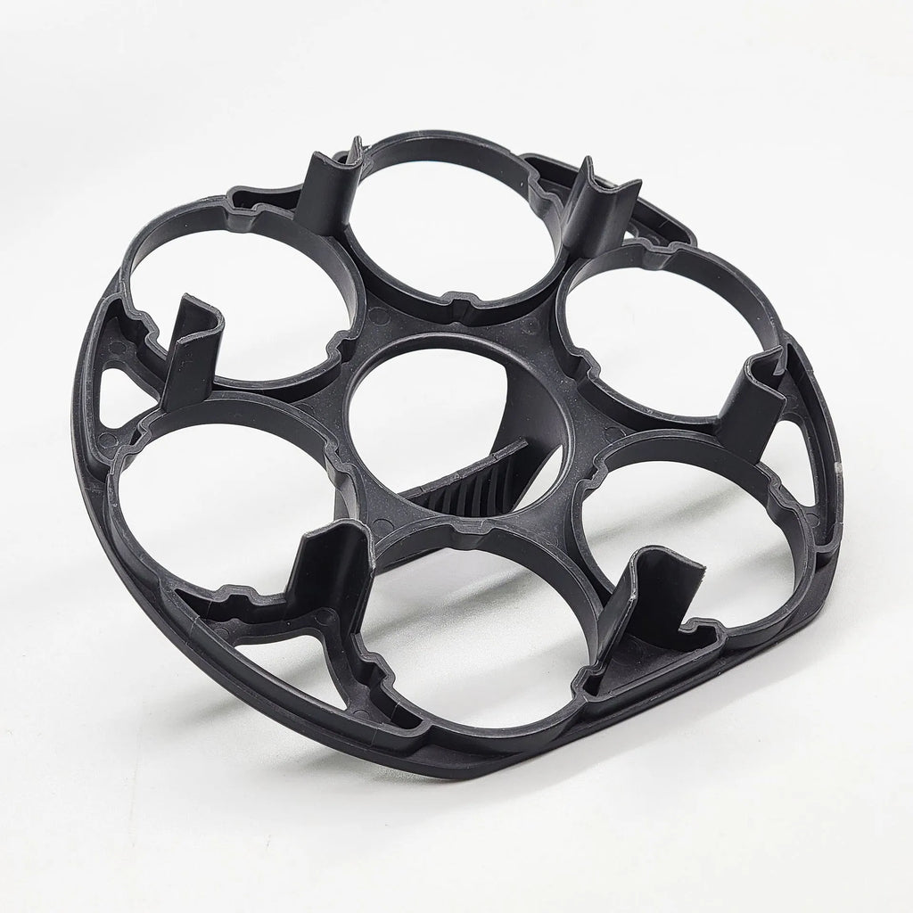 Black plastic egg holder basket for kitchen storage on a white background.