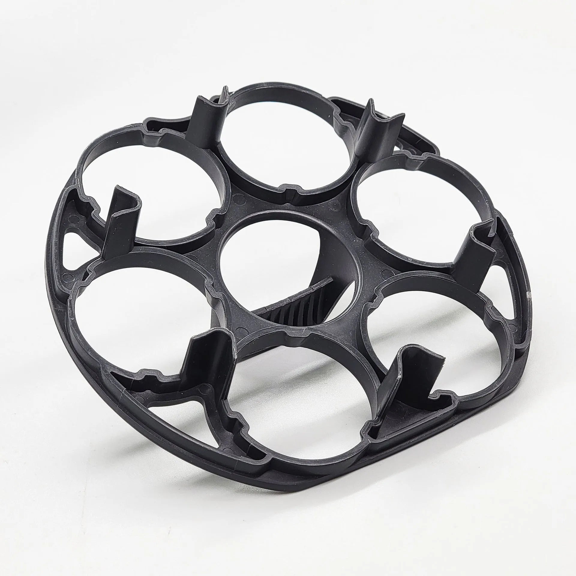 Black plastic egg holder basket for kitchen storage on a white background.
