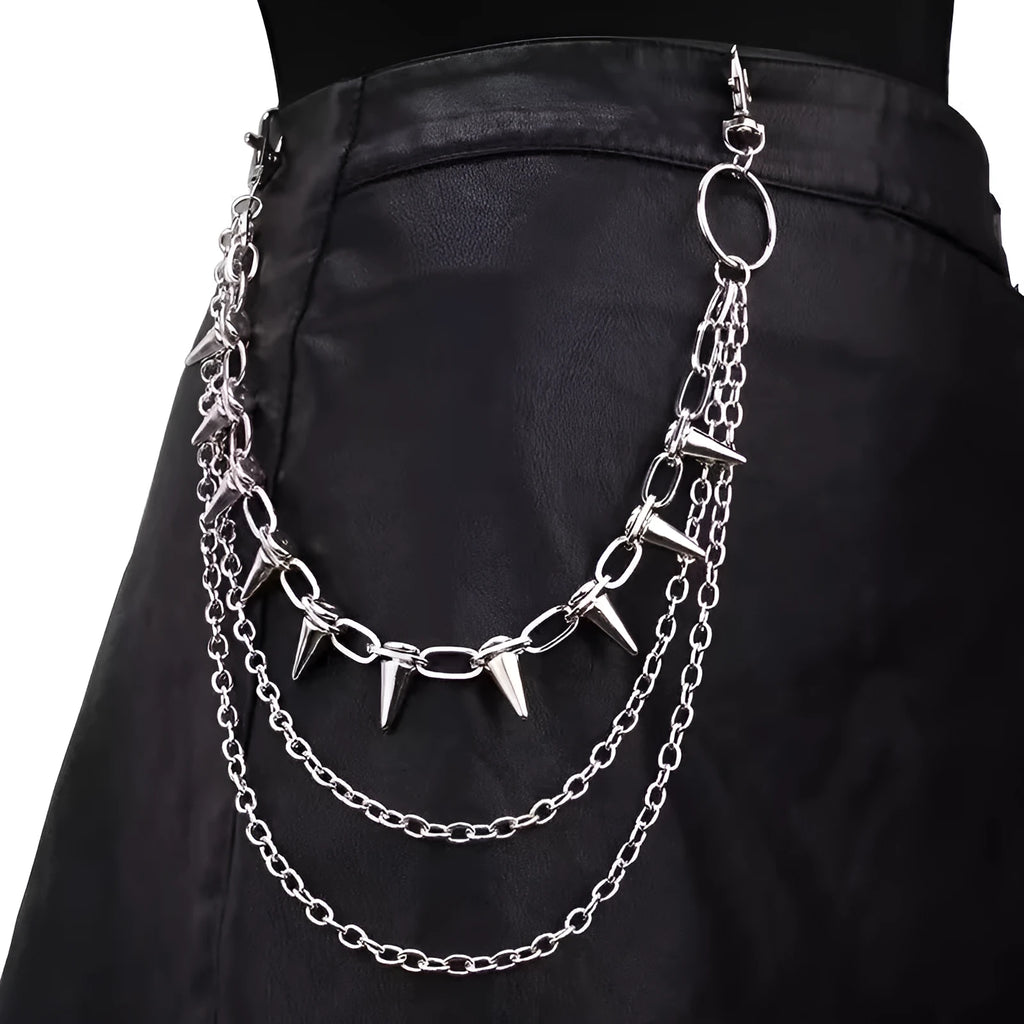 Silver double-layer pant chain with rivet accents and zipper details on dark trousers