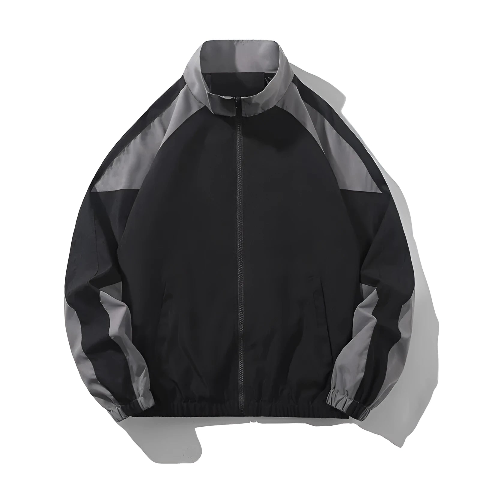Man wearing a black casual jacket with contrast stitching and side seam pockets.