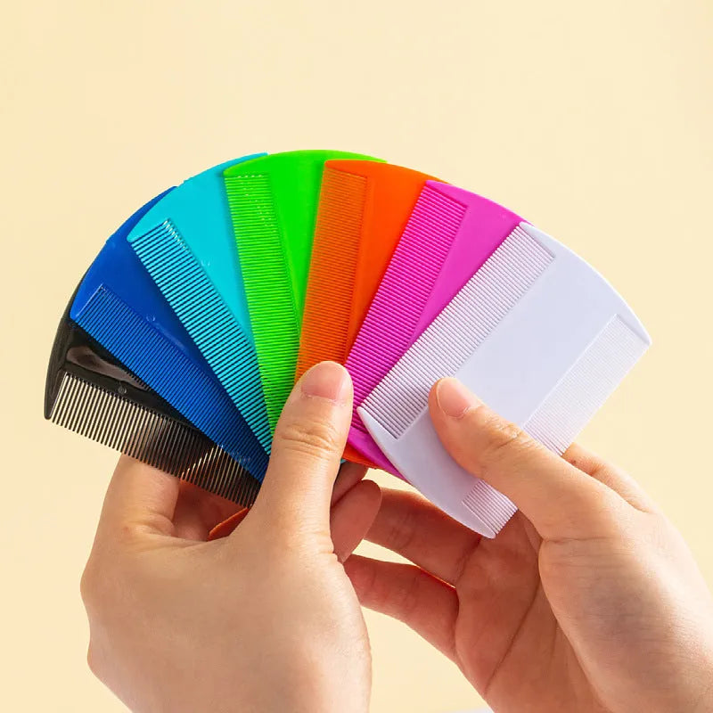 Double-sided plastic flea and lice comb with fine metal teeth, shown in assorted colours.