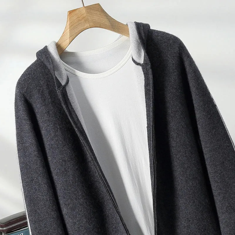 A man wearing a dark blue half-high collar zipper cardigan, a loose thickened sweater for winter.