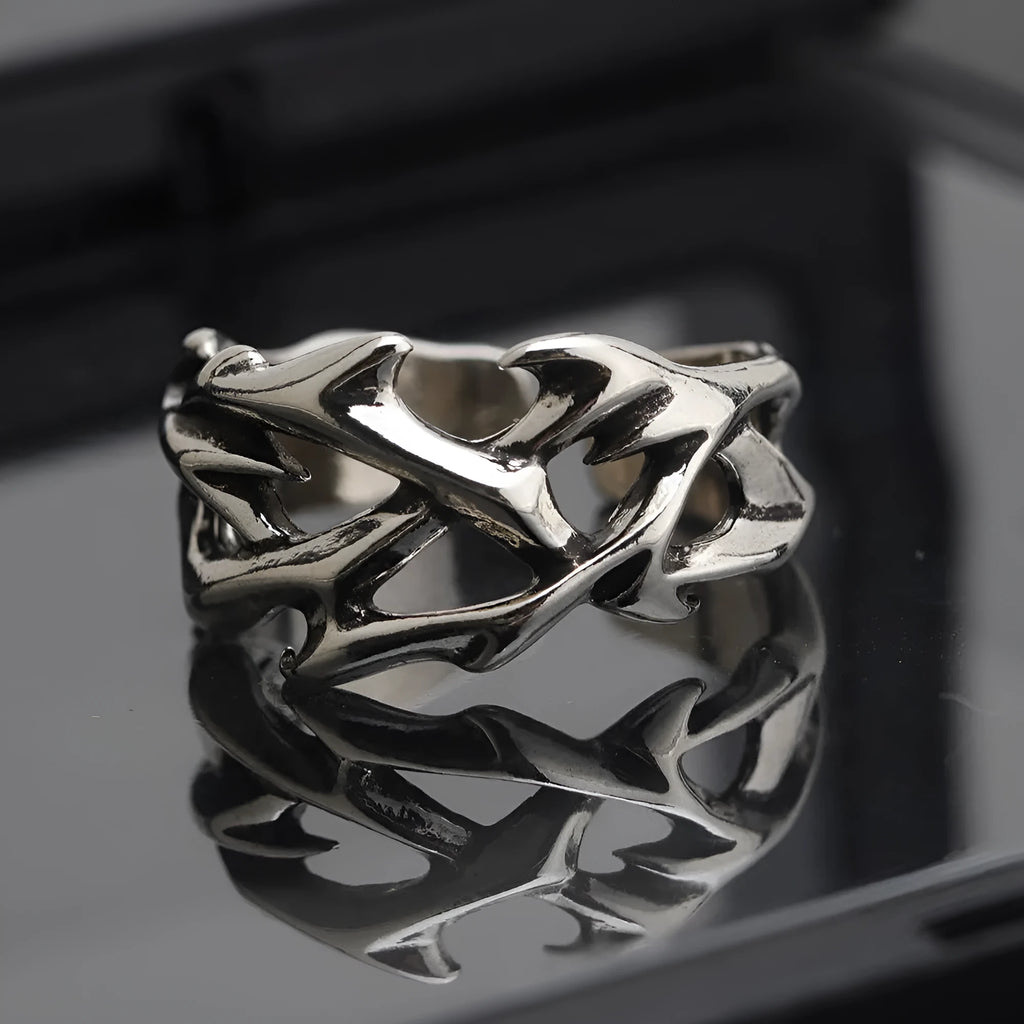 Copper geometric ring with thorn and flower design featuring adjustable opening