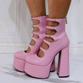 Women's black patent leather platform high heel boots with a thick heel and wrapped serpentine belt buckle