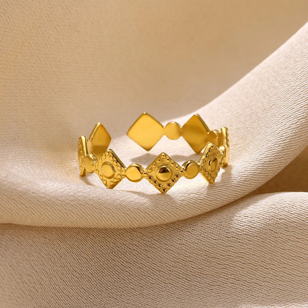 Gold titanium steel women's ring with geometric diamond design