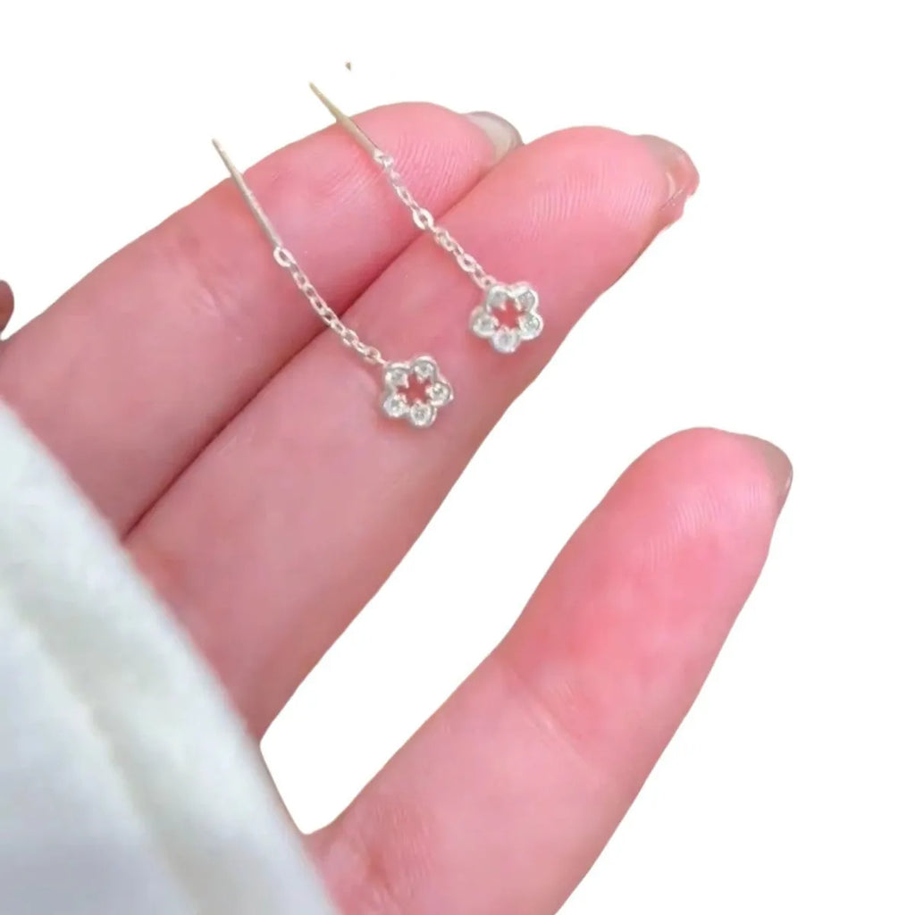 Silver colour hollow flower drop earrings with natural petal design and dangling length