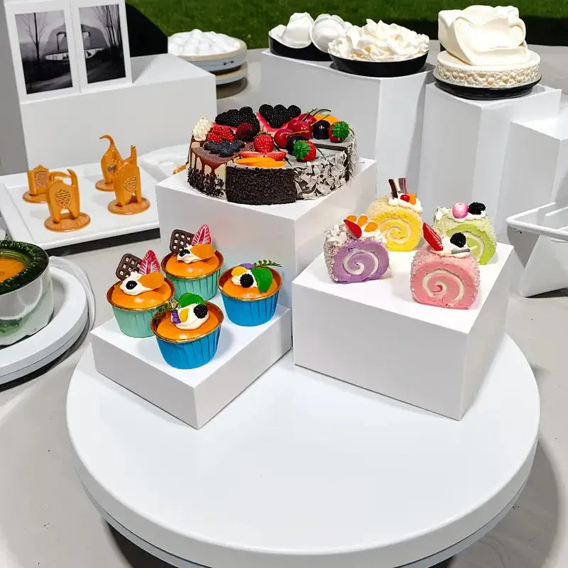 White plastic suit cube dessert display stand set with six tiered racks for bakery counter.