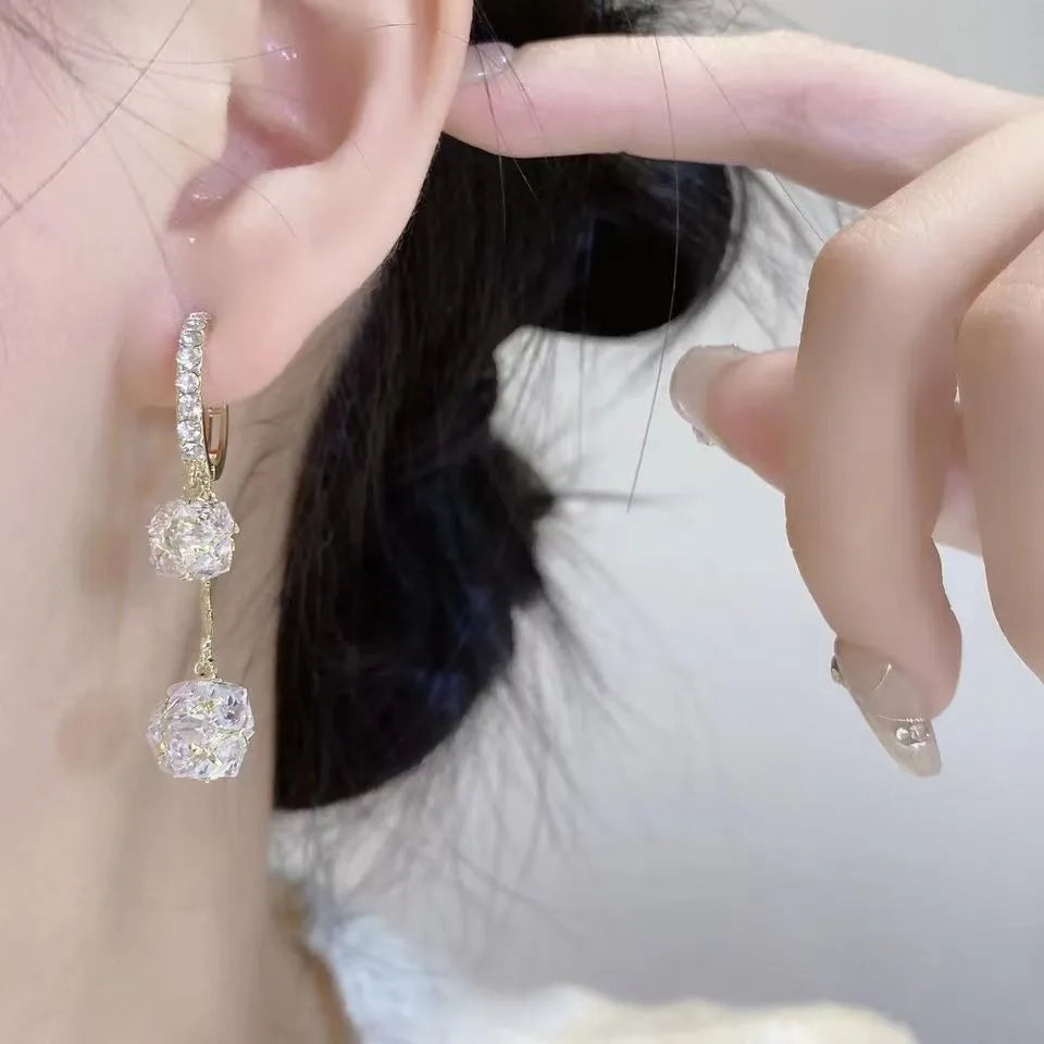 Silver drop shape women's earrings with rhinestone ball and tassel pendant designs