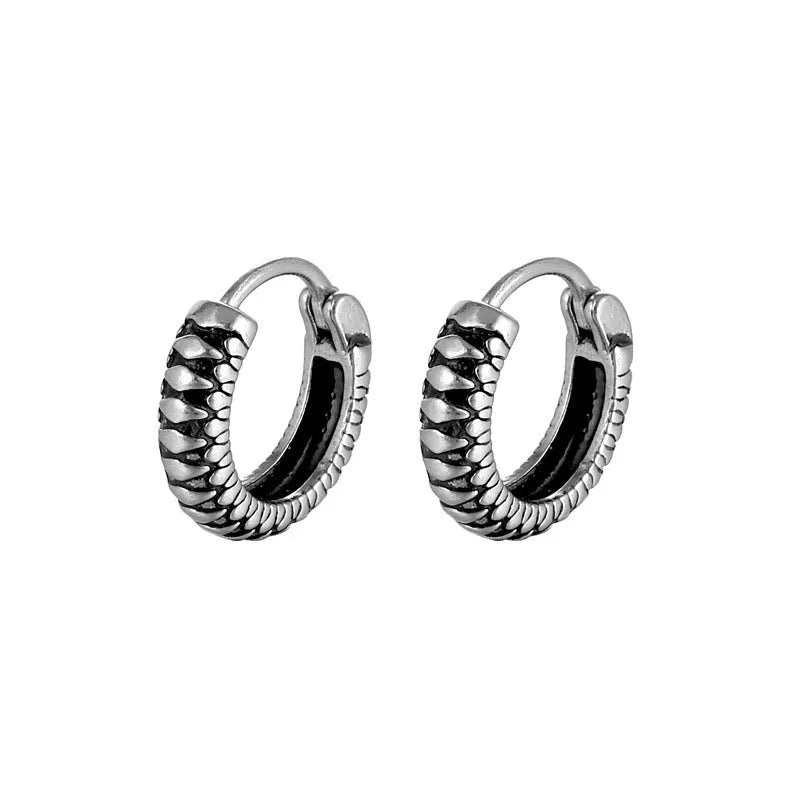 Silver geometric striped earrings with a circular centre, made from polished stainless steel.