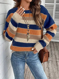 Women's black, blue, and grey colourblock striped polyester pullover sweater on a hanger.