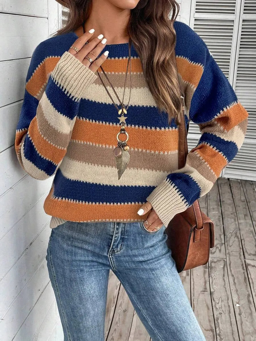 Women's black, blue, and grey colourblock striped polyester pullover sweater on a hanger.