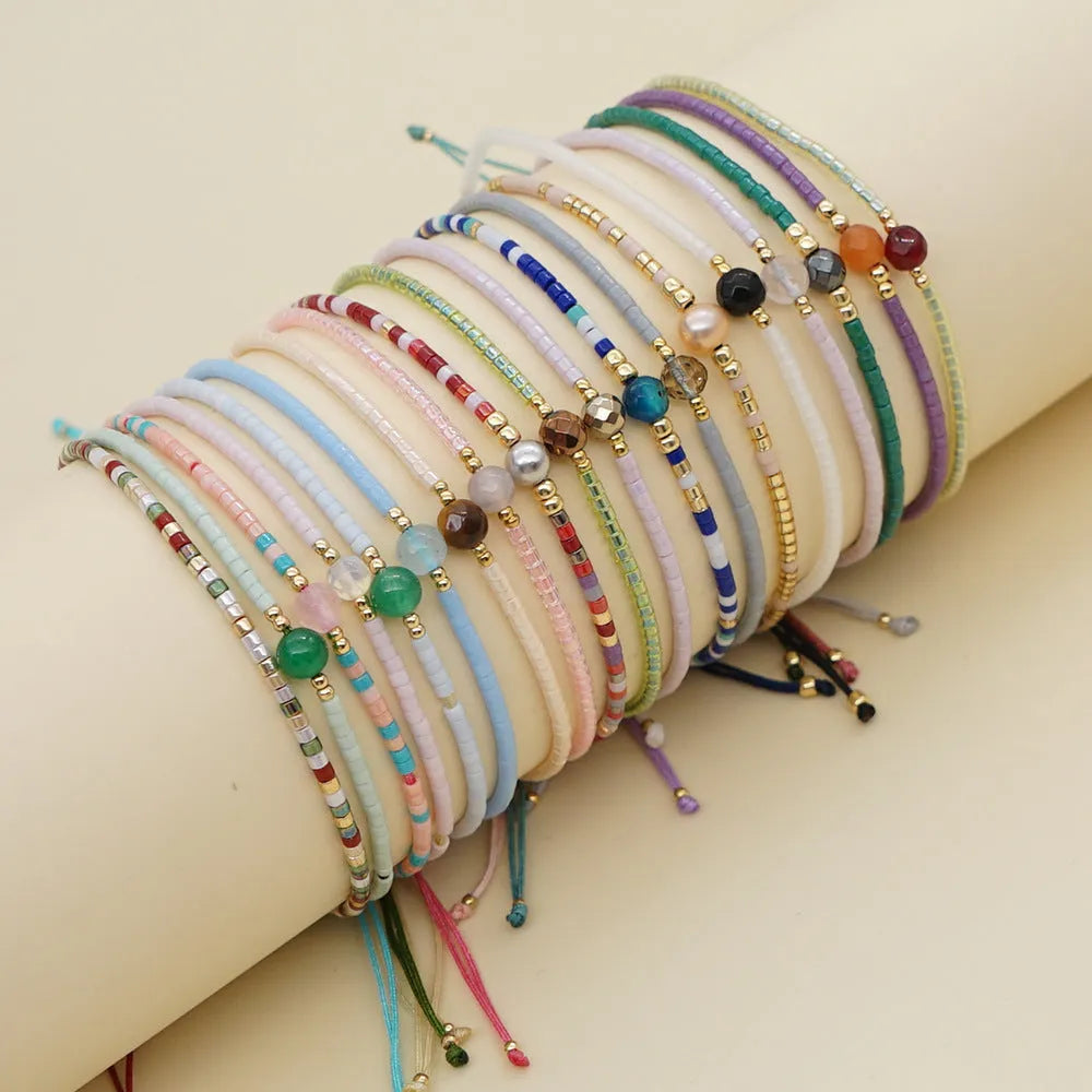 Colourful adjustable beaded bracelet with semi-precious stones and glass beads in bohemian style