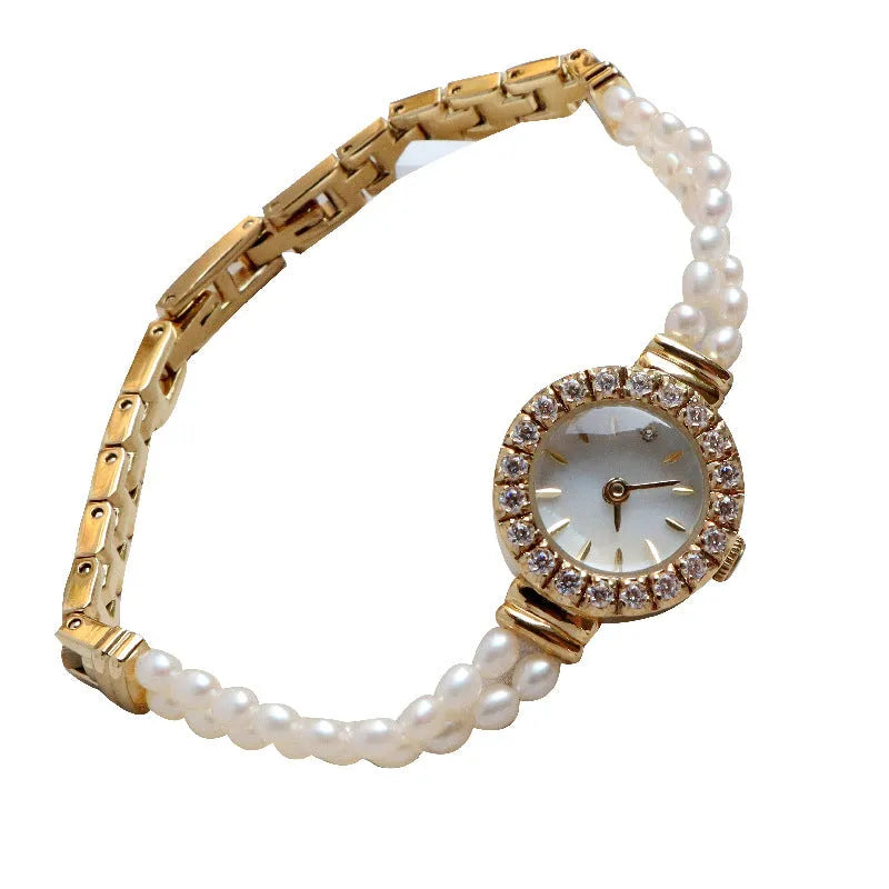 Women's light gold bracelet watch with freshwater pearls and round 18mm dial