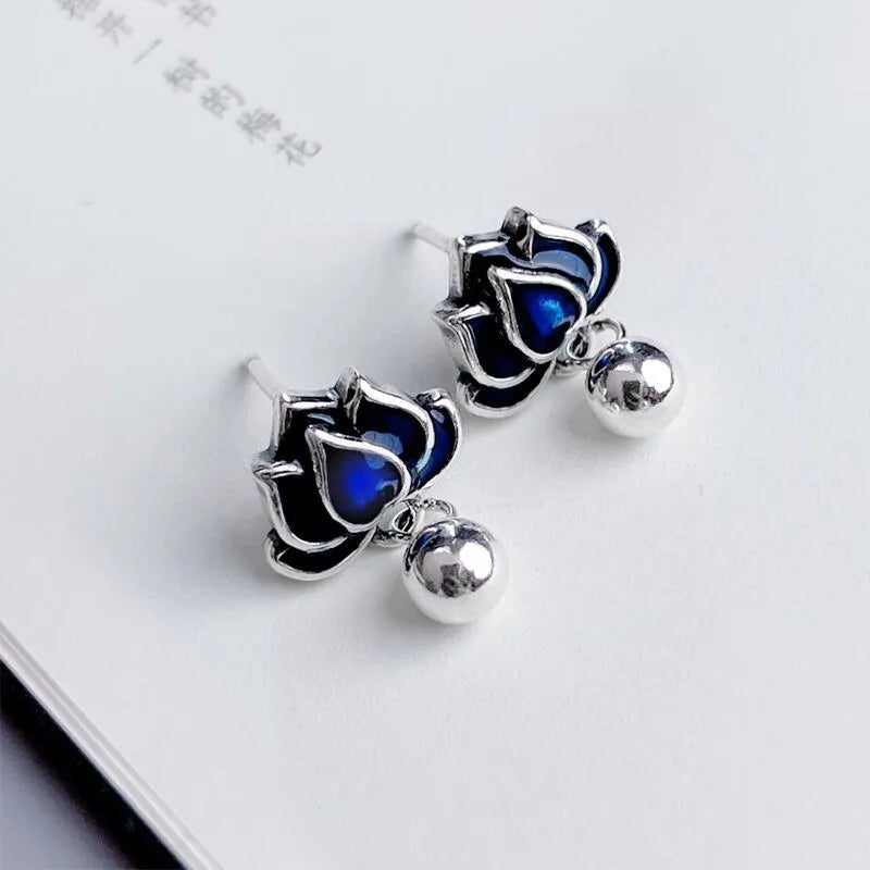 Blue lotus earrings with retro seedpod tassels measuring 1.2cm wide