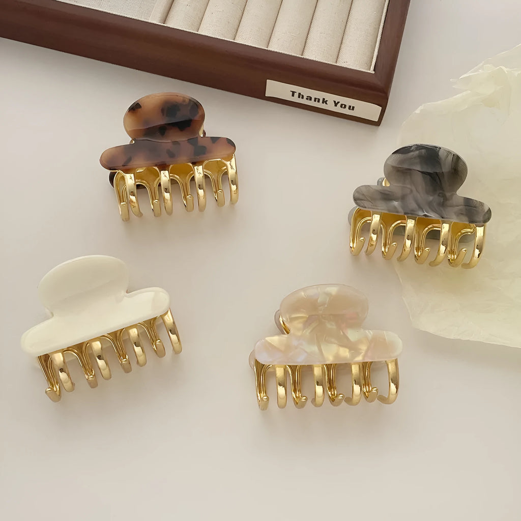 Women's retro acetate barrettes with metal grip in four colour variations including leopard print