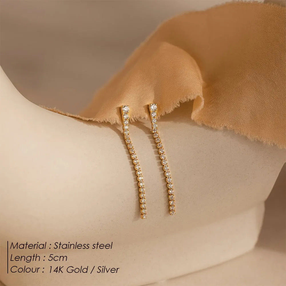 Gold and steel tone geometric women's earrings with zircon stones and line detail in Chinese style.