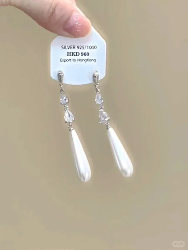 Women's geometric silver-tone alloy earrings with rhinestone star charms and tassel drops