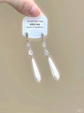 Women's geometric silver-tone alloy earrings with rhinestone star charms and tassel drops