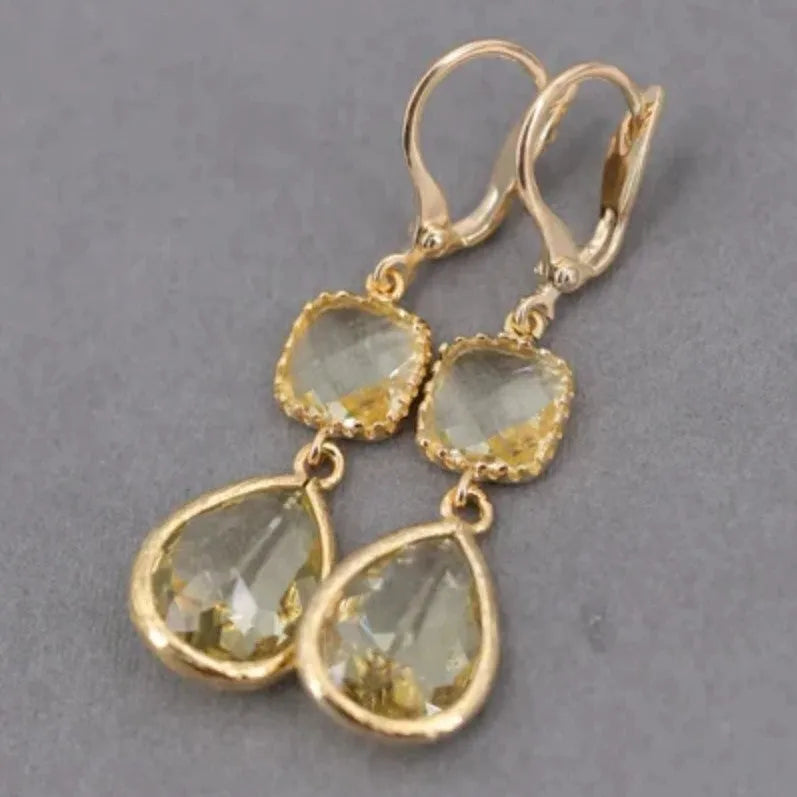 Gold geometric long fringe earrings with water droplet crystals on copper with electroplated finish