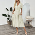 Light green lapel collar shirt dress with waist-tight skirt and commuter pockets
