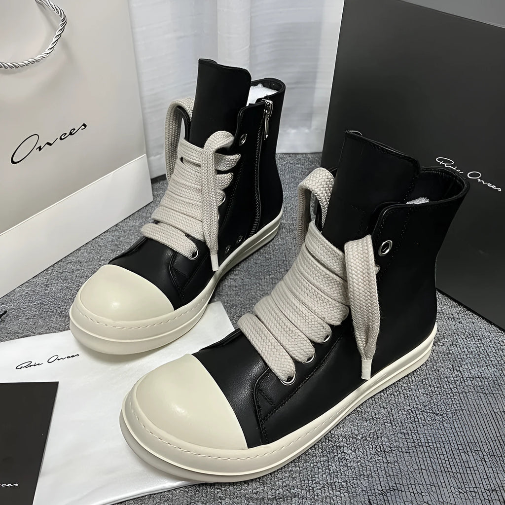 Black genuine cowhide leather high-top sneakers with a side zipper and platform sole.