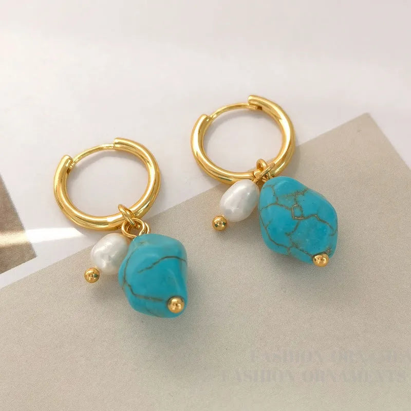 A pair of short and a pair of long turquoise cultured pearl ear clips with geometric copper settings.