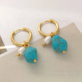 A pair of short and a pair of long turquoise cultured pearl ear clips with geometric copper settings.