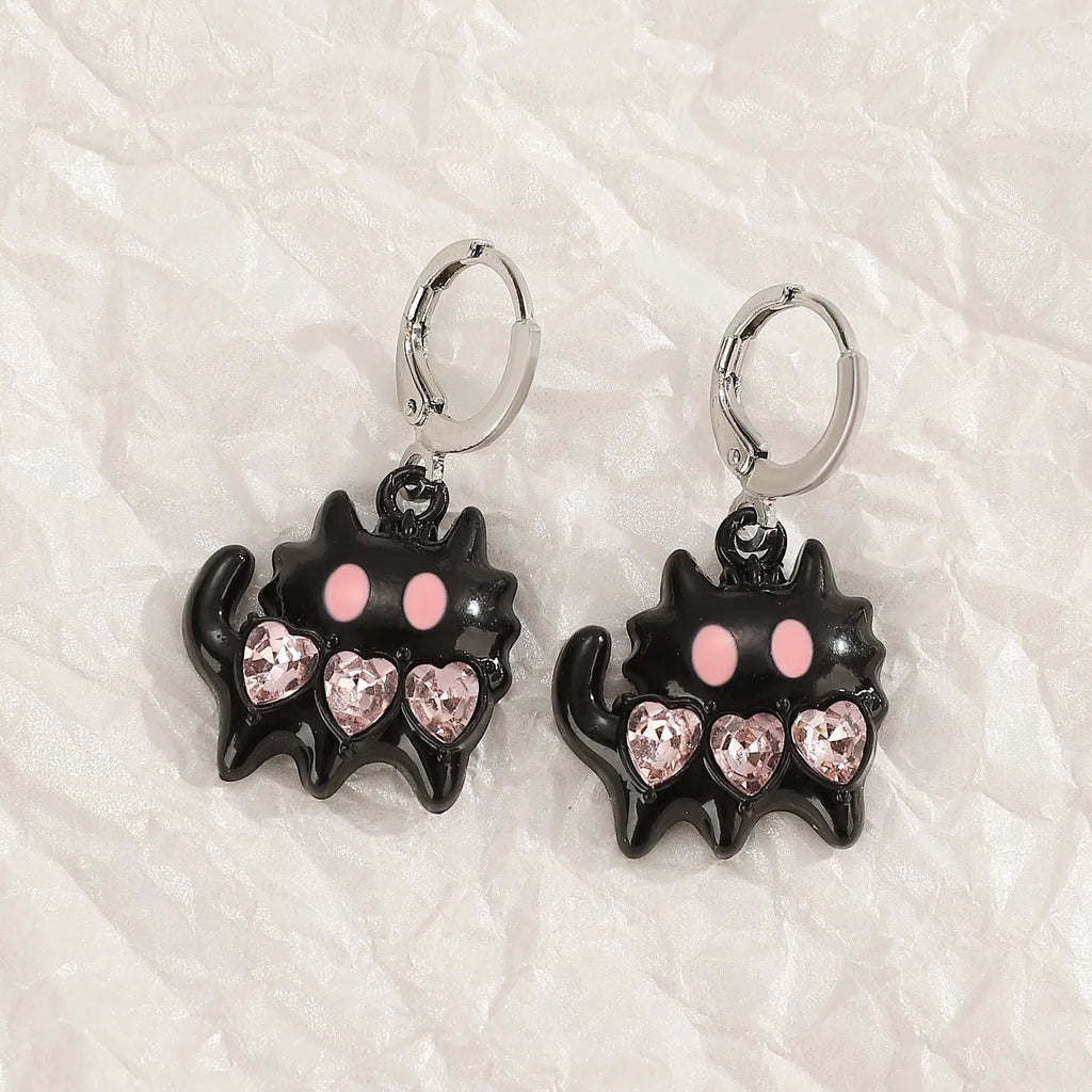 Women's alloy earrings with cross and heart designs in white, black, and silver colour options.