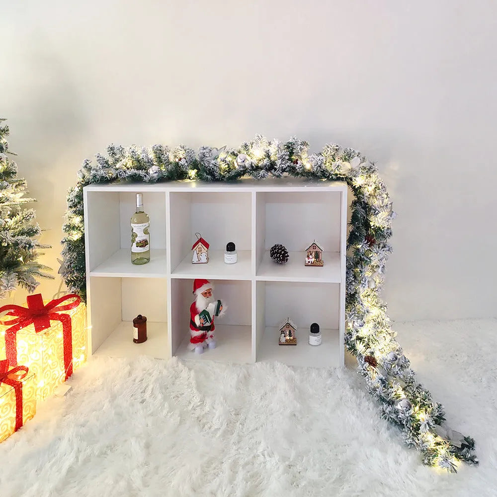 PVC Christmas rattan garland with flocking in red, hung on a door