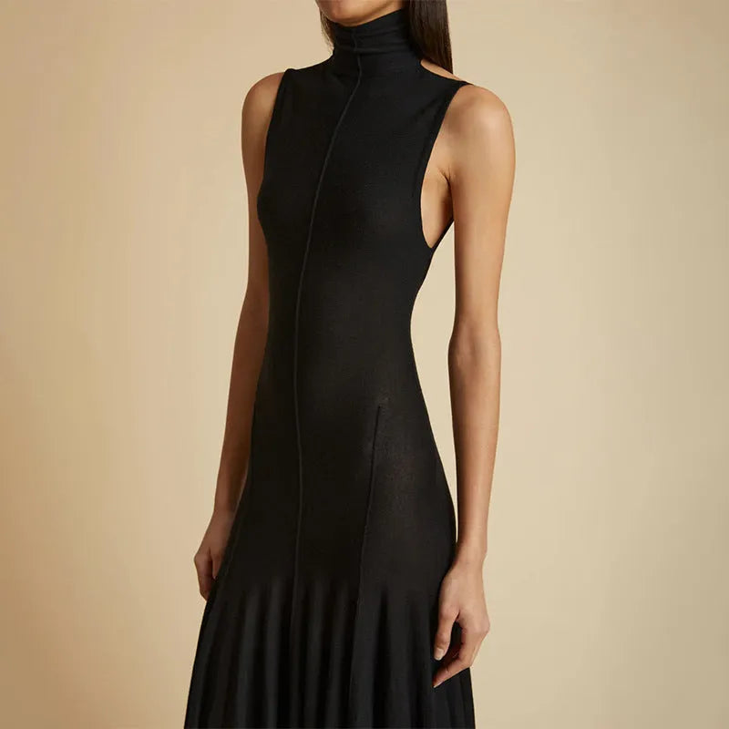 Grey slim-fit half turtleneck backless dress on a woman, showing sleeveless and high-waisted design.