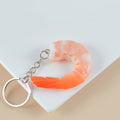 Realistic white shrimp-shaped PVC keychain charm with door buckle attachment