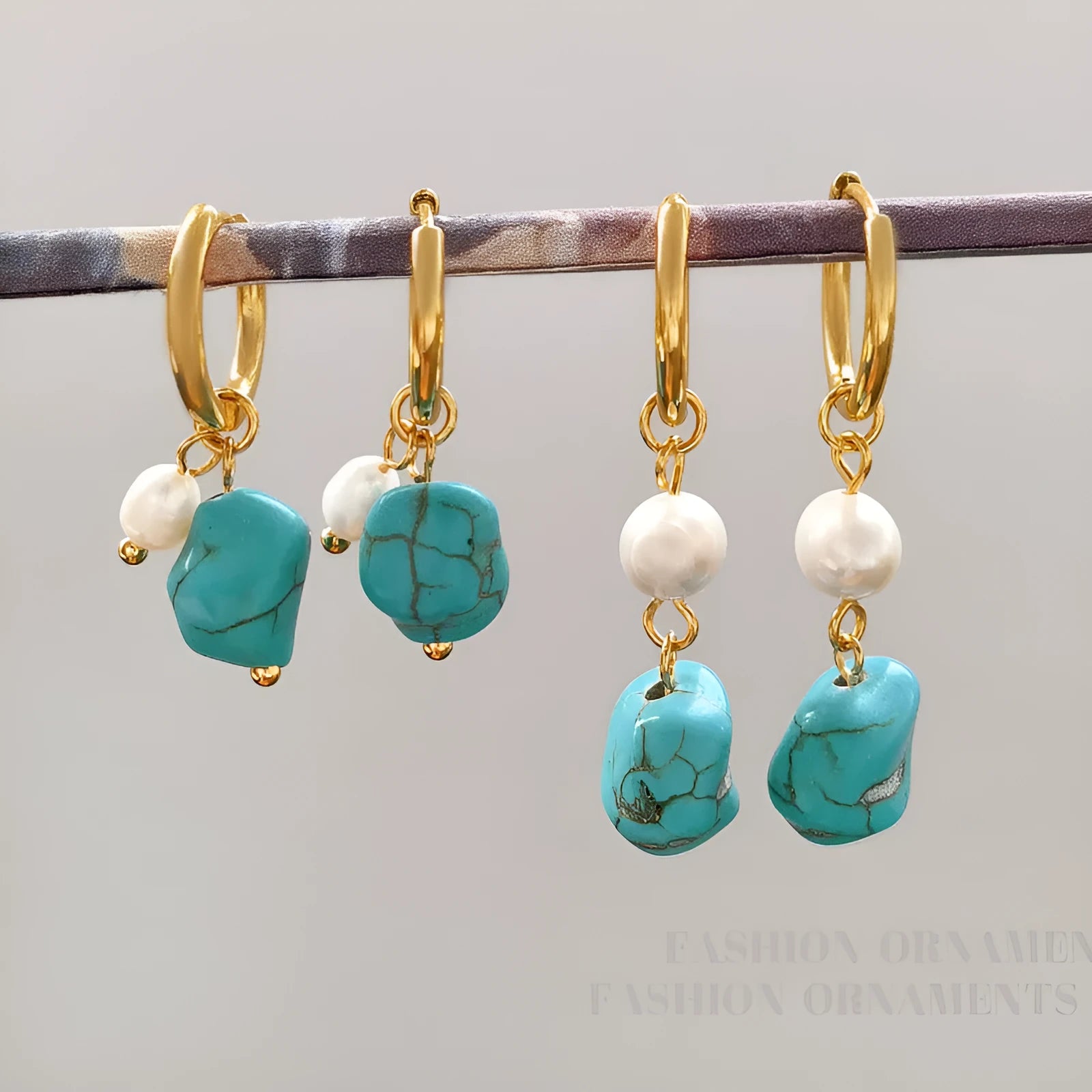 A pair of short and a pair of long turquoise cultured pearl ear clips with geometric copper settings.