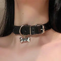 Black bell-shaped choker neck collar showing cat paw, bone, and leather style designs on an adjustable band.